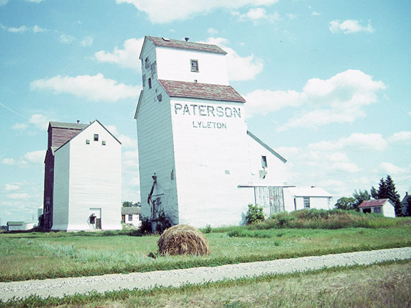Now-removed Paterson grain elevator at Lyleton, with a Manitoba Pool elevator in the background