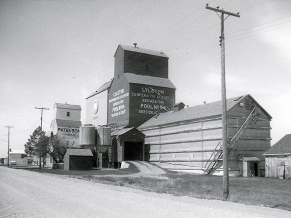 Manitoba Pool grain elevator at Lyleton with Paterson grain elevator in the background