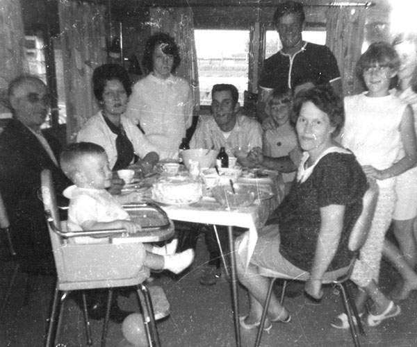 Members of the Paluch family at a meal in the former Lyons House
