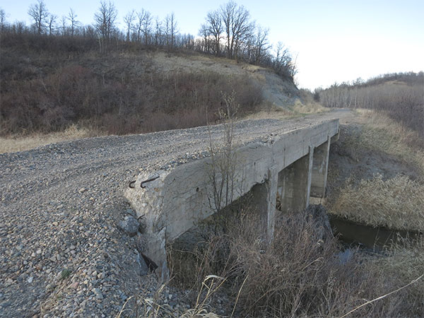 Remains of concrete beam bridge over Mary Jane Creek