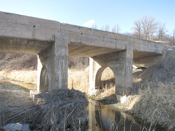 Remains of concrete beam bridge over Mary Jane Creek