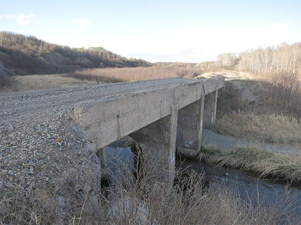 Remains of concrete beam bridge over Mary Jane Creek