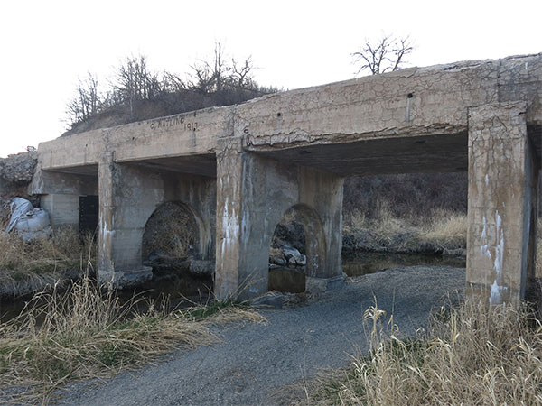 Remains of concrete beam bridge over Mary Jane Creek