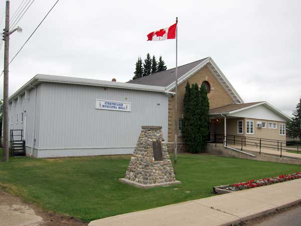 McMurachy monument in front of the Strathclair Municipal Hall
