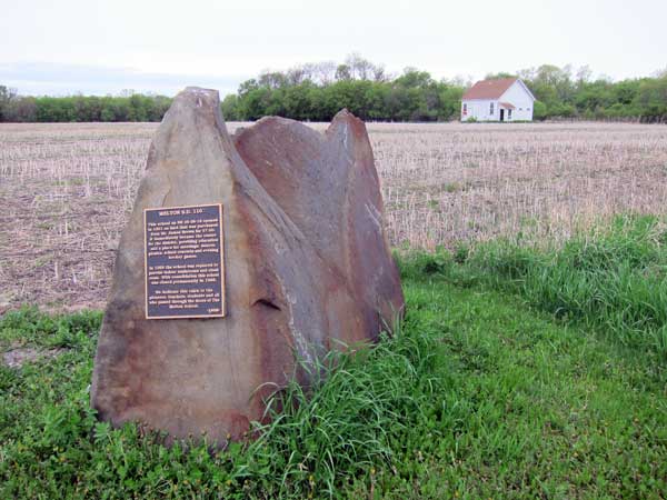 Melton School commemorative monument with school in background