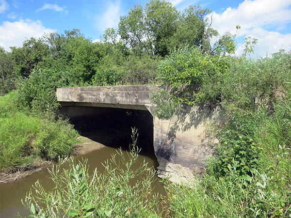 Concrete beam bridge over Minitonas Creek