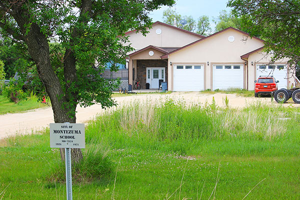 The former Montezuma School building with commemorative sign