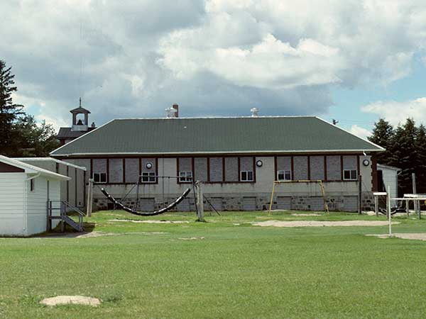 Notre Dame School building, situated at N49.53304 W98.55436