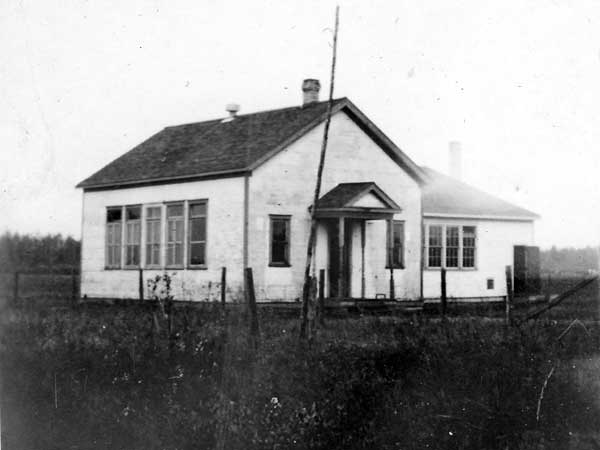 The original Pine Creek School with the second classroom at right