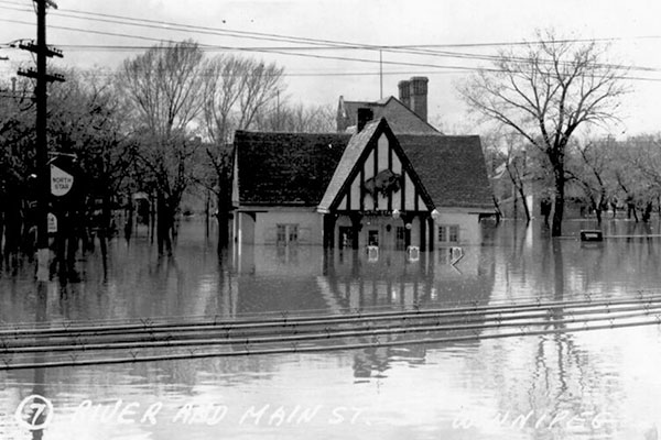 Postcard view of the North Star Service Station during the 1950 flood