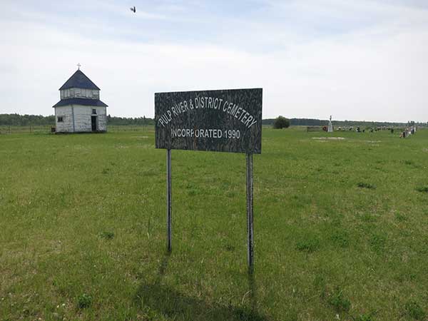 Pulp River and District Cemetery with the church bell tower in the background