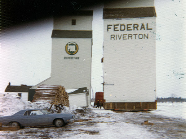 Manitoba Pool Grain Elevator with former Federal Grain elevator being moved beside it