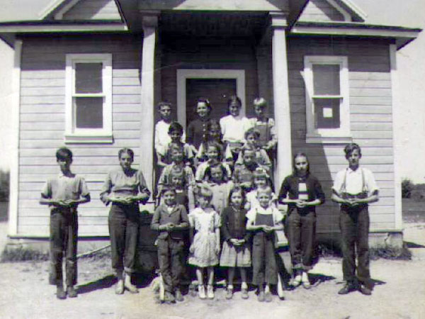 Group of students in front of the Skala School building