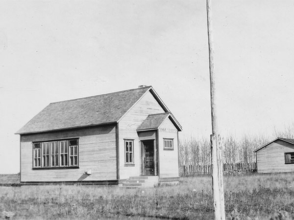 Somme School and its teacherage at right