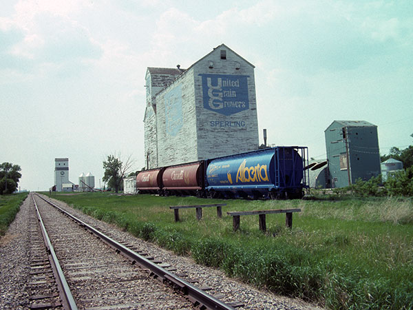 Manitoba Pool grain elevator in the background with the United Grain Growers grain elevator
