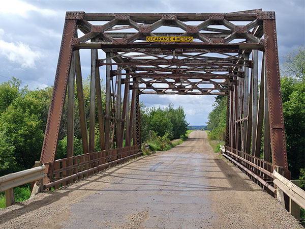 Steel through truss bridge over the Bowsman River