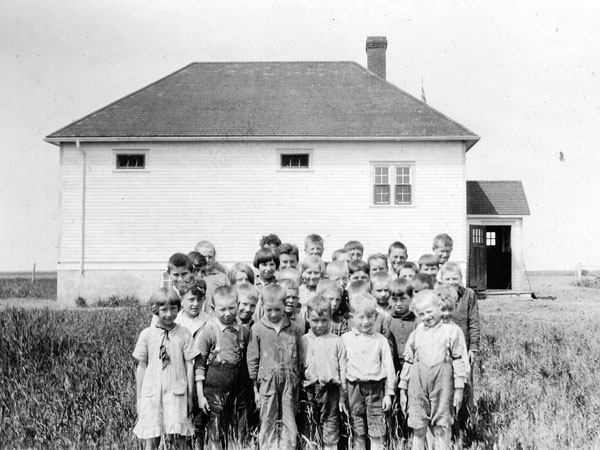 Students beside the Steinfeld School building