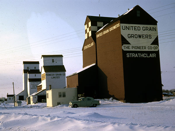 United Grain Growers grain elevator at Strathclair with a Pioneer Grain grain elevator and Manitoba Pool grain elevator in the background