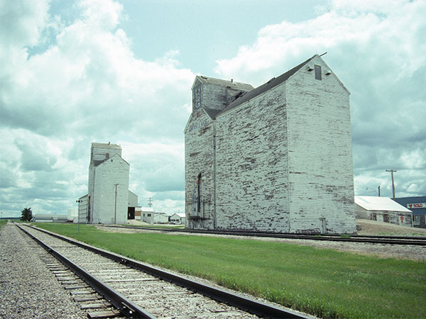 United Grain Growers grain elevator at Swan Lake, with the Manitoba Pool grain elevator in the background