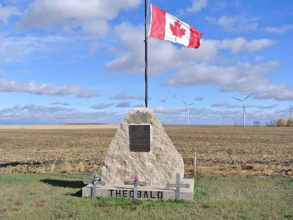 Theobald School commemorative monument, at the base of which are crosses commemorating three murder victims in the Labossiere family who formerly lived nearby