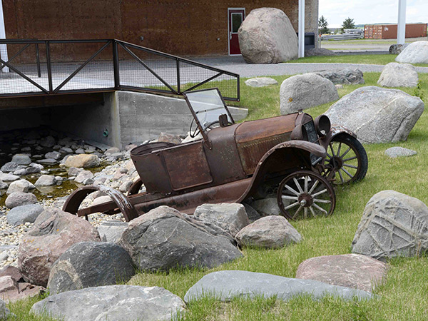 An antique car outside the Treherne Second Chance Auto Museum