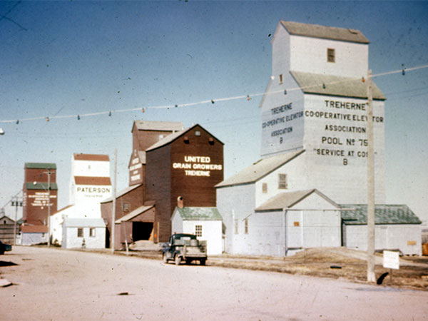 The Paterson grain elevator at Treherne with the UGG and Manitoba Pool B (formerly Ogilvie) elevators in the foreground with Manitoba Pool A elevators in the background