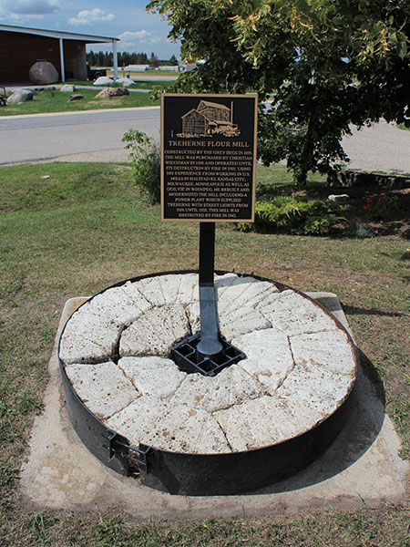 Wiechman Flour Mill millstone and commemorative plaque