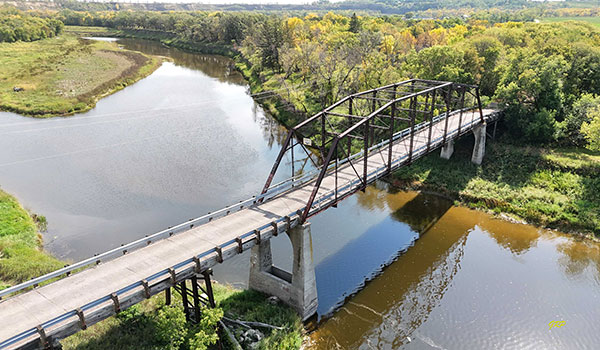 Aerial view of steel through truss bridge #727 over the Souris River