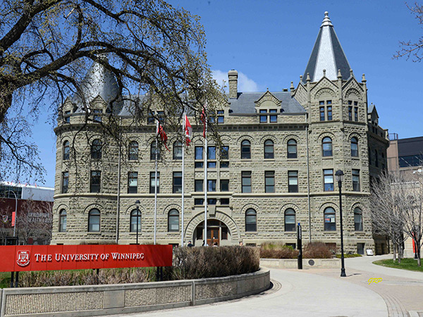 Wesley College Building from the front with the University of Winnipeg Sign