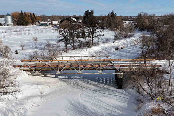 Aerial view of steel pony truss bridge over the Wilson River