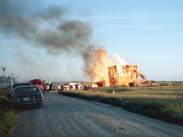 Remains of the former Wood Bay grain elevator being burned
