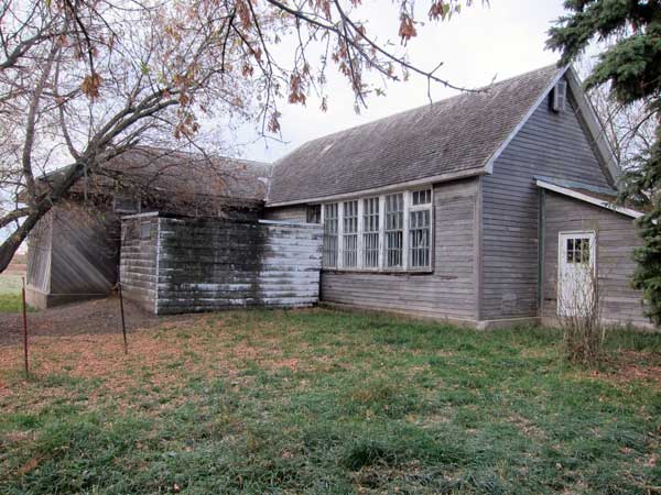 Rear exterior of the former Woodnorth School building showing the original classroom