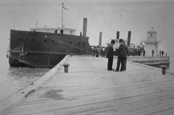 Rosamond Billett lying outside breakwater at Gimli Harbour, by the Gimli Lighthouse