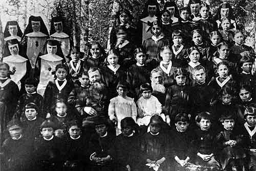Indian children with teachers at Cross Lake, Manitoba, 1919