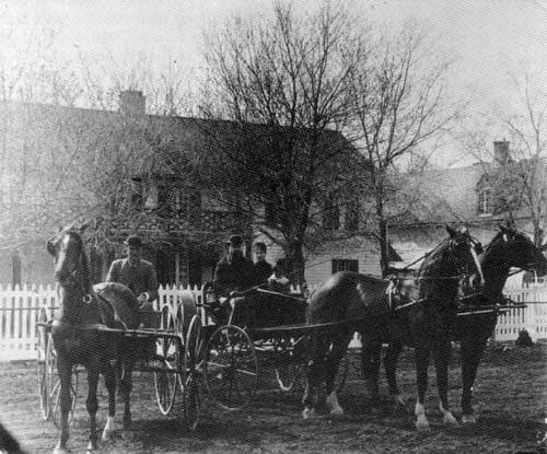 The McKay home at ‘Deer Lodge.’ James McKay is seated centre holding the whip.