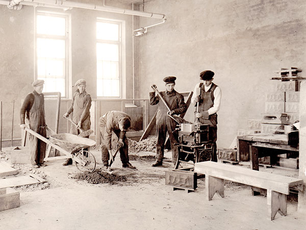 Concrete block making is demonstrated in this photo from around 1917, at the Manitoba Agricultural College (now the University of Manitoba).