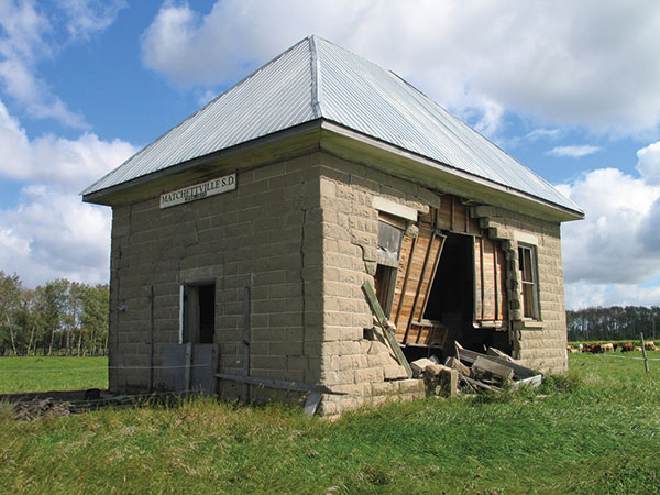 Matchettville School No. 1342 (RM of South Norfolk). According to local legend, the district was originally known as Bachelorville due to the scarcity of women in the early days of settlement, and was renamed Matchettville when the bachelors married. A more likely possibility is that it was named for members of the Matchett family who homesteaded here. The Matchettville School District was established in May 1905 and, the next year, a concrete-block school building was erected by Frank Thomson. The school operated until 1951 when, due to declining enrollment, it closed and remaining students were bused to school in Treherne. The building was sold to a local farmer and used as a granary. Its south wall was damaged extensively when an agricultural implement collided with it in 2003.