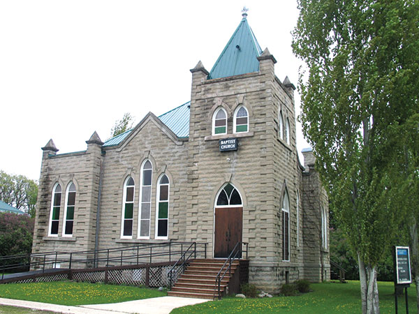 The Emerson Baptist Church (Emerson) was designed by Winnipeg architect Hugh McCowan. It was built in 1905 by local contractor David Wright, who also built a manse for the pastor, as well as several private residences around town, most of which survive today. Local lore has it that Wright stopped making concrete block buildings when his mould broke.