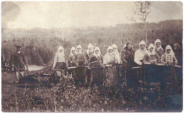 Postcard of Doukhobor women pulling a plow, circa 1908.