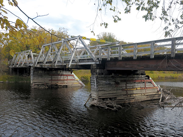 A derelict wooden bridge over the Whitemouth River, built by Winnipeg’s Reidle Brewery, is now closed to all traffic.