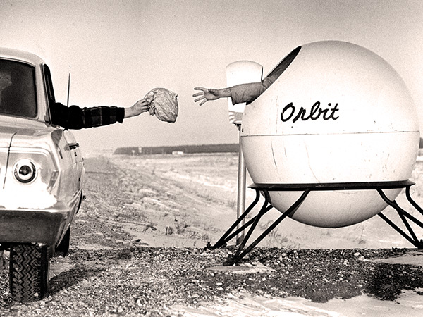 According to legend, Ray Olecko used his experience with fibreglass to help in designing Orbit, a fibreglass trash receptacle for Manitoba highways, that was introduced by the government in the mid-1960s. Orbits proved so popular that some weary roadside travellers took to spending the night in them, as this whimsical photo from the Winnipeg Tribune sought to re-create.