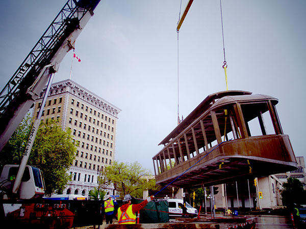 Bloody Saturday Street Car Monument being lifted into place
