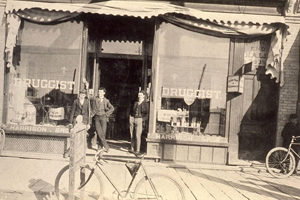 Storefront of Harrison Brothers drugstore in the Craig Block