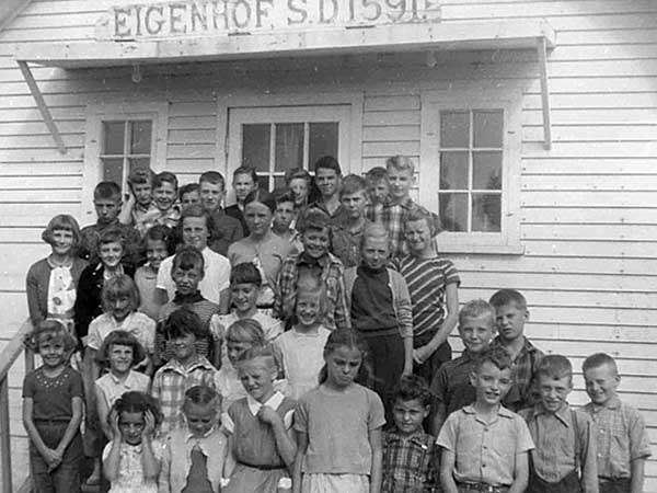 Students in front of the school entrance