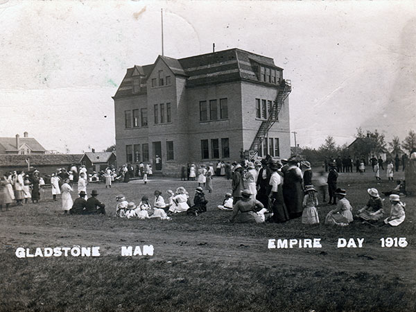 Postcard view of Empire Day activities at the first Gladstone School