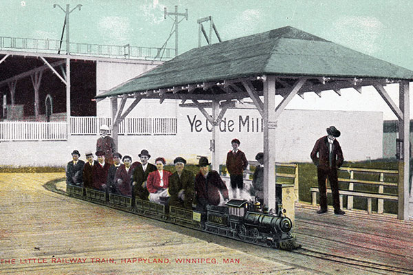 Postcard view of mini train at Happyland