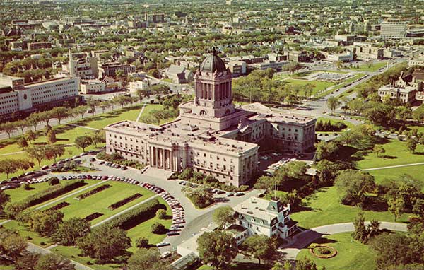 Postcard view of the third Legislative Building, with Government House in the right foreground