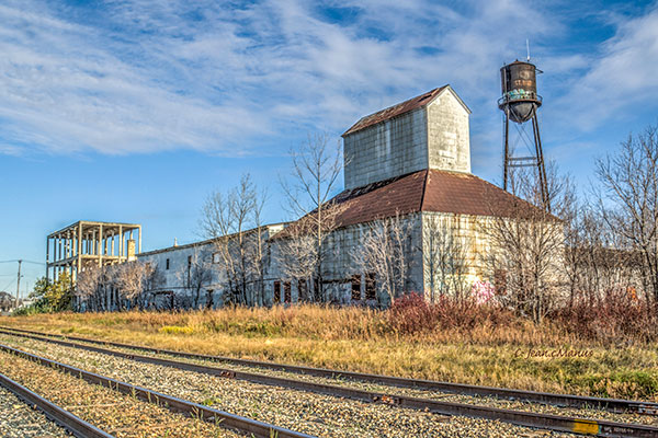 Former McCabe grain elevator with warehouse and whisky distillery in background