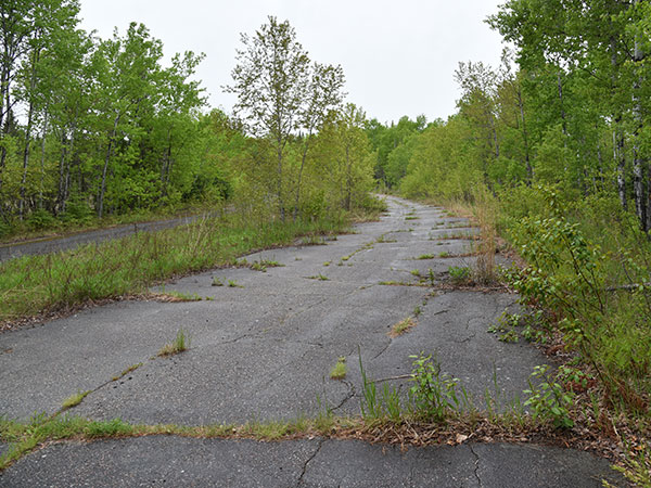 Abandoned portion of the Trans-Canada Highway near the commemorative monument
